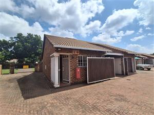 Situated in this peaceful and well kept complex in Arcon Park is this Face brick Townhouse.
