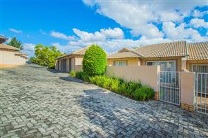 this beautifully renovated townhouse in the sought-after Ruimsig Country Estate is not to be missed