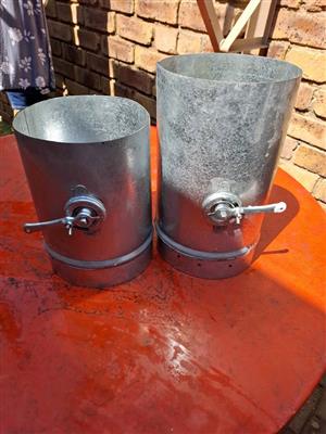 Galvanized chimney 150mm flue pipe with a butterfly valve and handle to regulate the warm air.