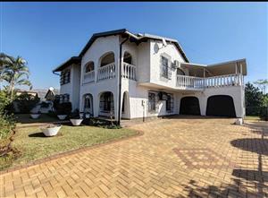 Elegant Double-Storey Residence with Dual Living Options and Coastal Convenience