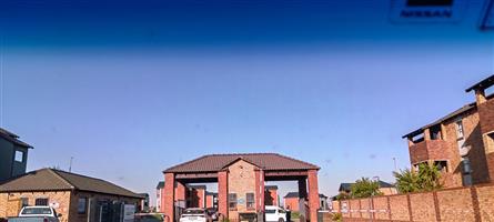 This charming 2-bedroom townhouse in Johannesburg South, Route 82 Security Estate Village