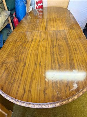 Antique wallnut dining extended table with embossed legs and border with 3 chairs