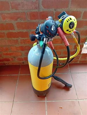 Scuba tank and all  regulators. Working as is.