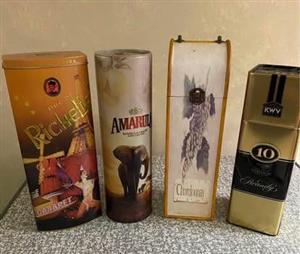 Three empty collectors tins 