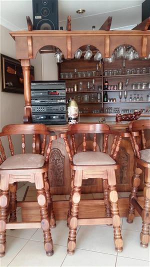 Complete bar with canopy,4 chairs, counter, shelf on the wall, mahogany wood.