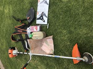 Stihl FS250 brush cutter with harness and accessories.