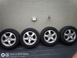 Honda 15" rims 5 holes with tyres for sale still in good condition 195/65/15