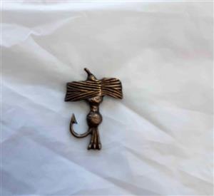 Vintage copper-plated lapel pin.