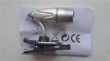 Clipable Mini light. With batteries inside. By Eskom. Four to choose  