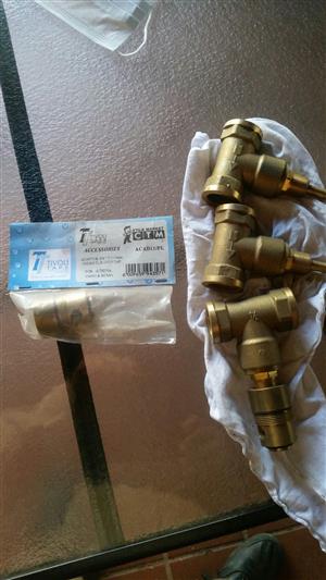 Brass colored plumbing attachments.