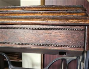 Antique Singer treadle sewing machine cabinet — dating from the early 1900s