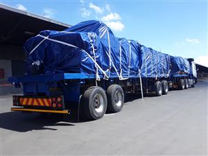 SECURE AND PROTECT YOUR CARGO WITH OUR QUALITY TARPAULINS,CARGO NETS AND TRI-AXL