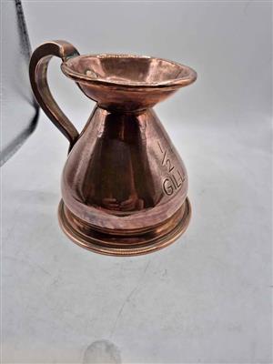 Antique copper measuring jug