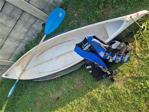 Canoe and life jacket for Sale
