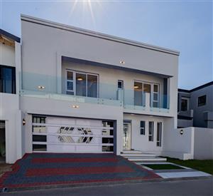 A Modern Artistic Masterpiece in Upper Sandown!