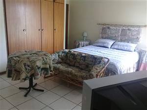 Fully furnished clean and neat bachelors room including lounge area and own shower for rent