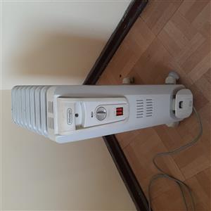 Light grey 8 fin oil heater.