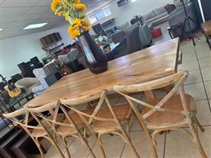 Solid wood dining table with 4 Cross-Back Chairs and a Bench.