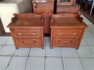 Pair of rustic, two-drawer wooden bedside tables or pedestals