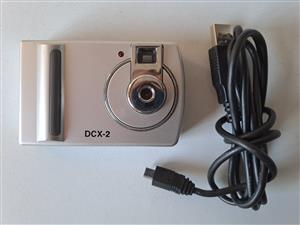 Digital Camera DCX -2 with USB cable. Takes three AAA rechargeable batteries. R5