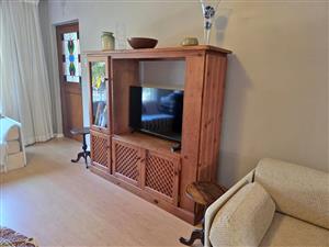 Solid pine entertainment wall unit – TV cabinet & display shelves, used