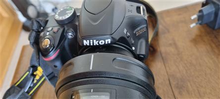 Nikon SLR Camera plus ,600mm Tamron lens and pro tripod