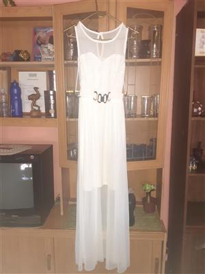 White dress with long tail, short front, no sleeves from Truworths.