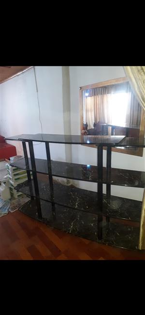 Black room divider/TV unit in good condition which can be assembled 4 tier high.