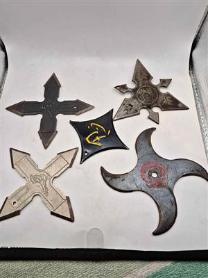 5 x Shuriken, commonly known as a ninja star or throwing star.
