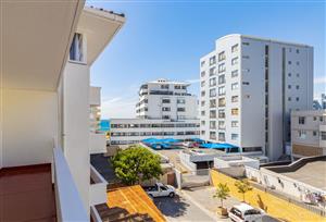 Sea Point Gem: Elegantly Renovated 2-Bedroom with Balcony, Street Parking, and Pre-Paid Power!