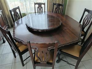 Octogon table with Lady susan and side Board, and leather seated chairs