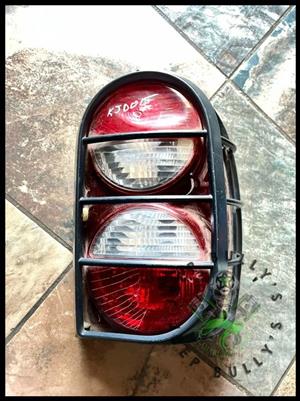 Jeep Liberty (KJ) Renegade Driver Side Tail Light with Guard