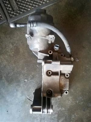 BMW OIL FILTER HOUSING WITH ALTERNATOR BRACKET