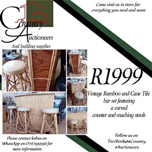 Vintage Bamboo and Cane Tiki bar set featuring a curved counter and maching stools