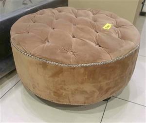 Beige round ottoman