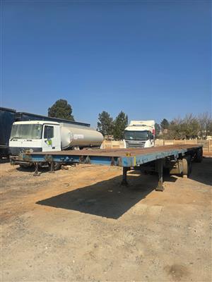 2003 Henred flatdeck Spring link trailer for sale 