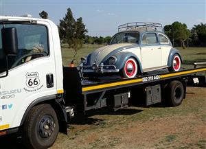 VW and other Classic Car Transport with flatbed rollback truck.