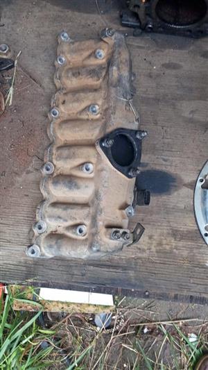 Kia K2500 engine parts including block, water pump, oil pump, cams, timing cover, etc