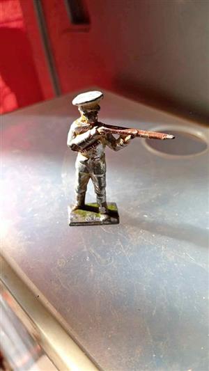 This is a vintage hollow-cast lead toy soldier