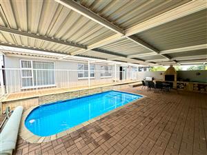 Immaculate Entertainer’s Dream with Heated Pool, Income-Generating Flat & Four Garages