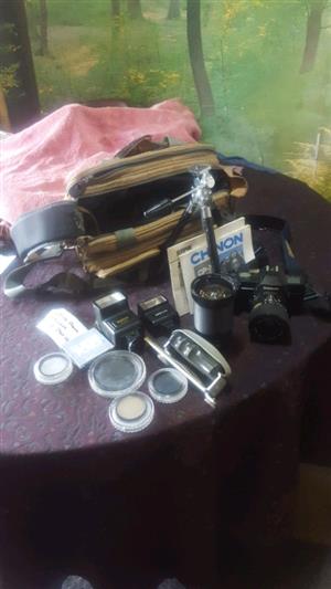 CP-7m Chinon SLR Camera with multiple accessories.
