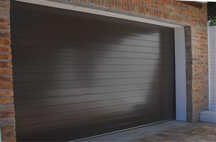 NEW ROLL UP AND SECTIONAL GARAGE DOORS FOR SALE - WILL BEAT ANY WRITTEN QUOTE!