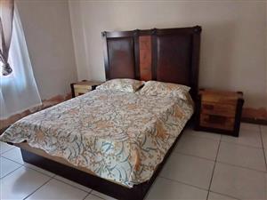 Wood sleigh bed , side pedestals,mirror drawers