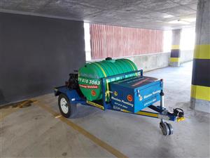 Trailer mounted drain cleaning/pressure washer