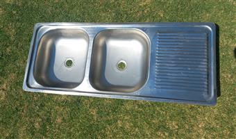 Stainless steel double kitchen sink.