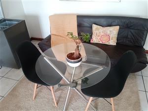Glass top table and two chairs