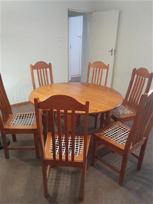 Solid wood round table and six chairs for sale