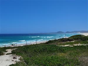 Stand in quiet area, close to beach.