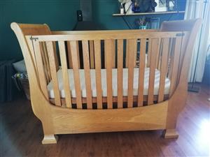 Large solid oak custom made cot that converts into a toddler bed