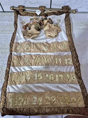 Fabric Christmas Advent calendar designed to be hung on a wall.